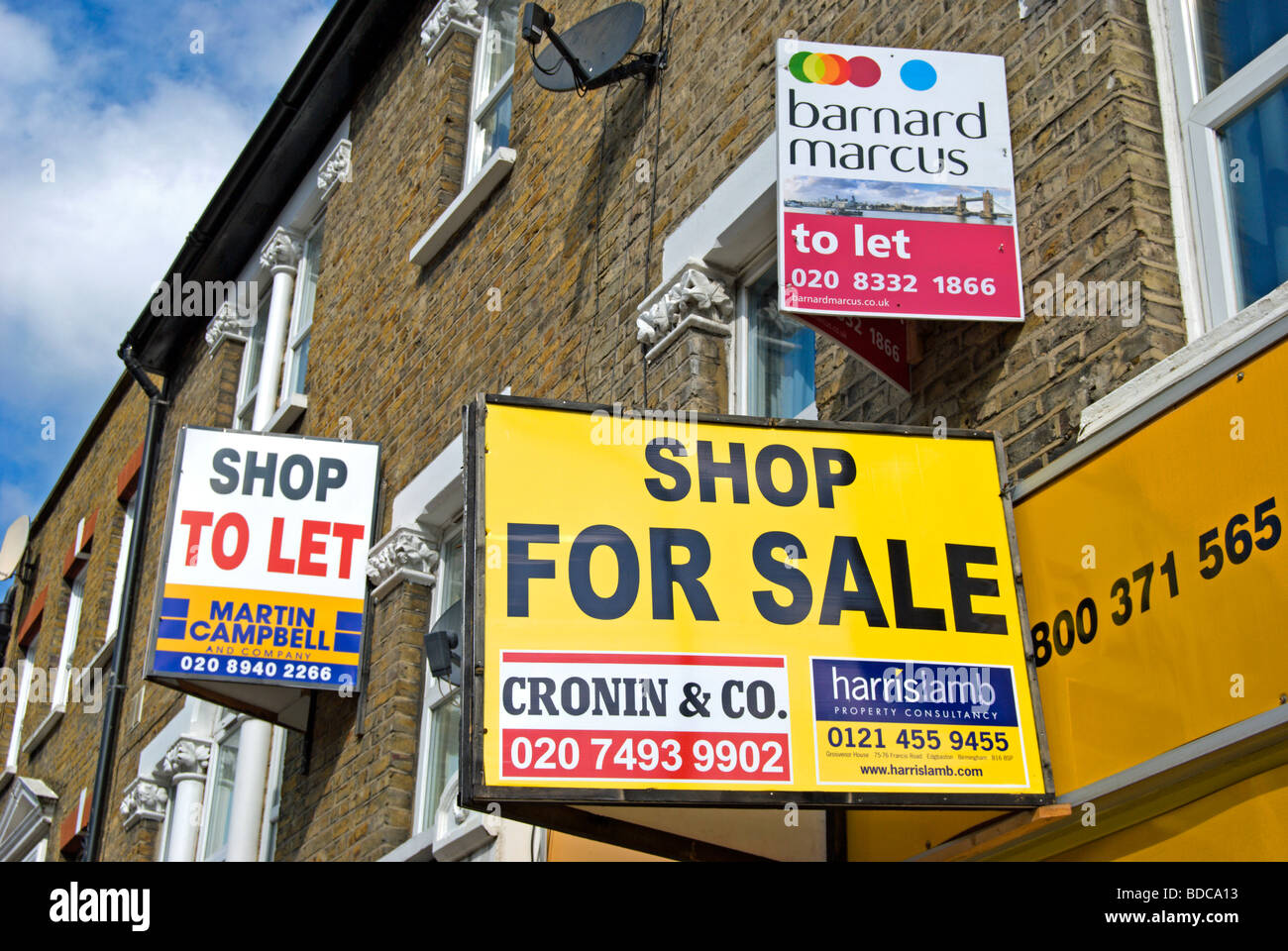 shop to let and shop for sale signs in east sheen, southwest london, england Stock Photo