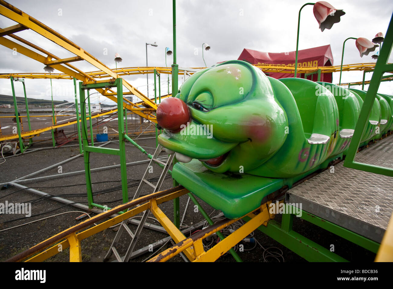 A green caterpillar roller coaster ride at Helensburgh, Scotland. Stock Photo