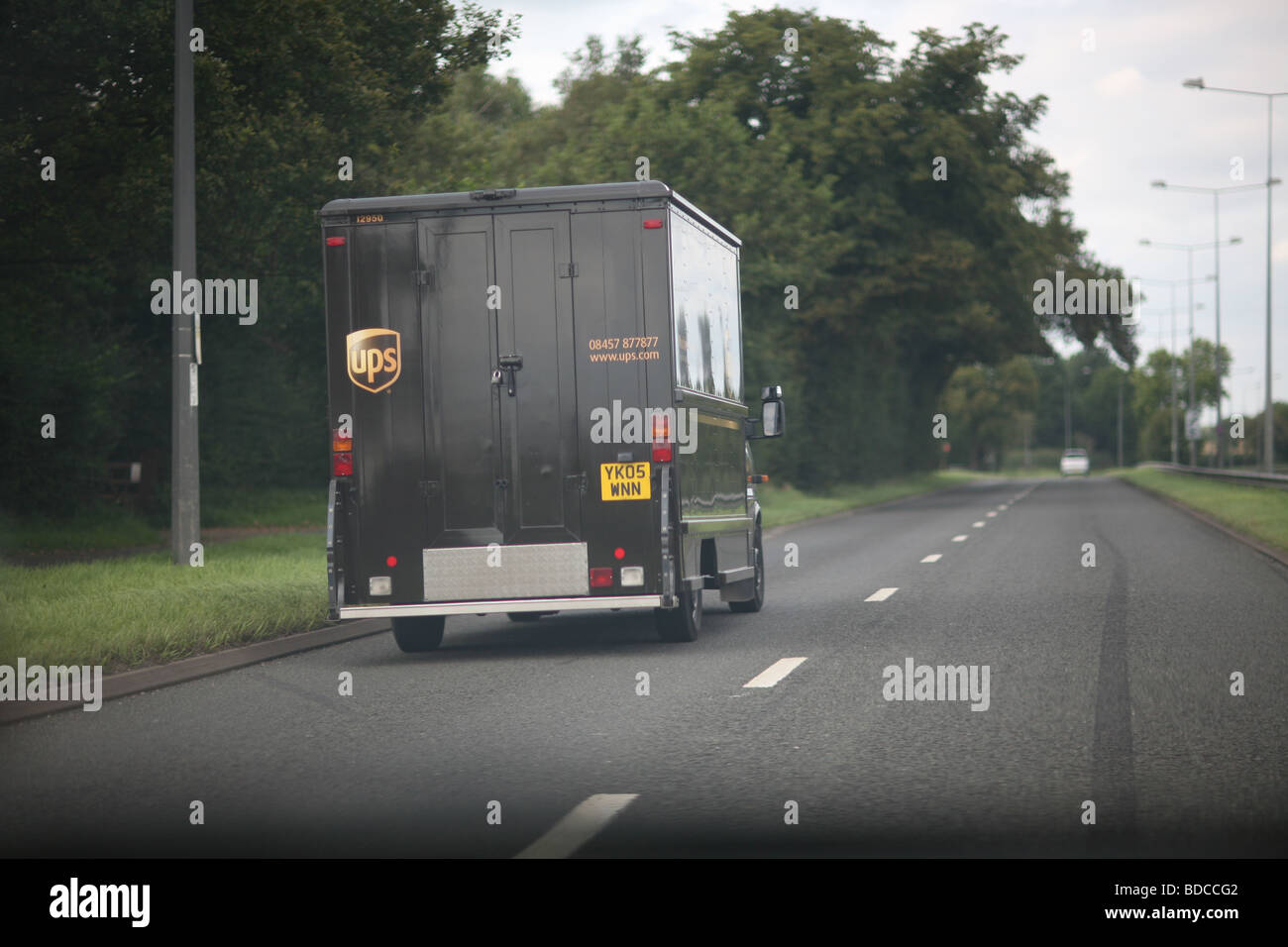 A UPS parcels delivery van in transit on a UK road Stock Photo