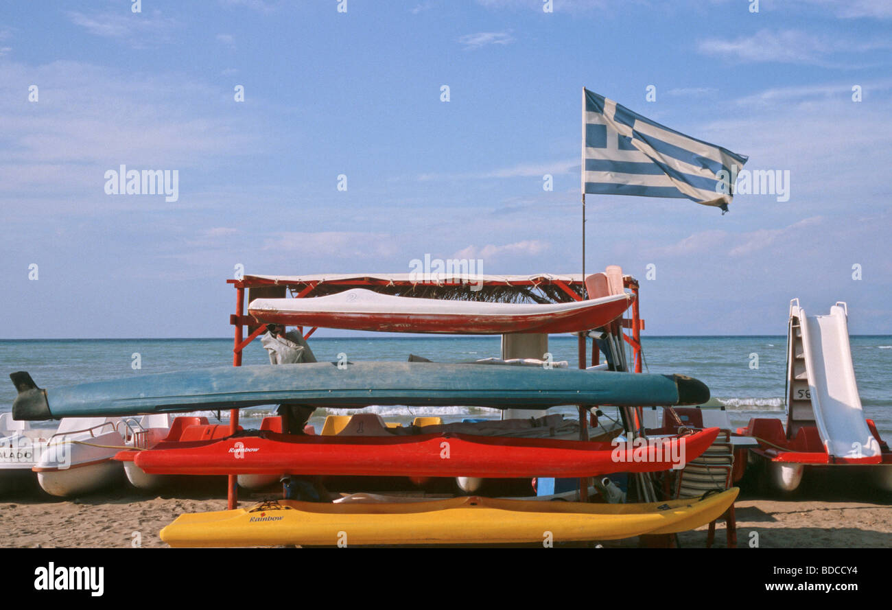 surfboard and greek flag on the beach Roda Corfu Island Greece Stock