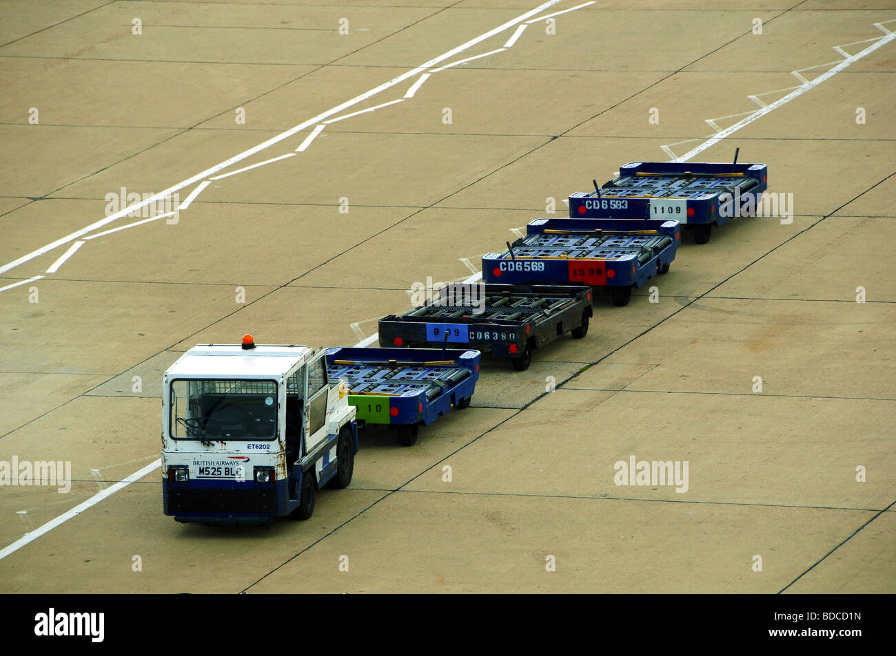 Baggage truck at Gatwick Airport, UK Stock Photo Alamy