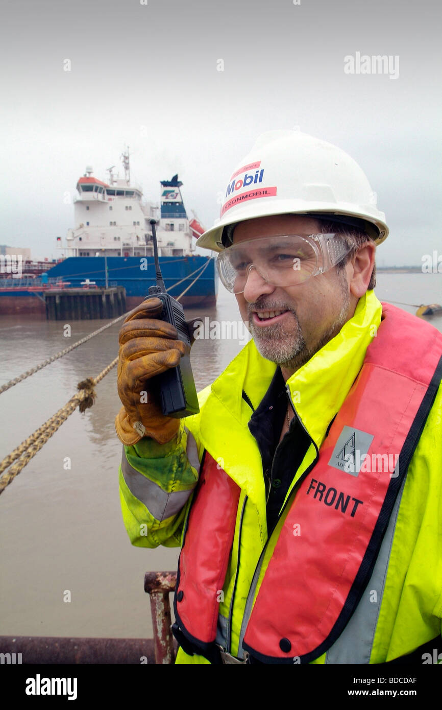 Dockside worker berthing an LNG tanker Stock Photo