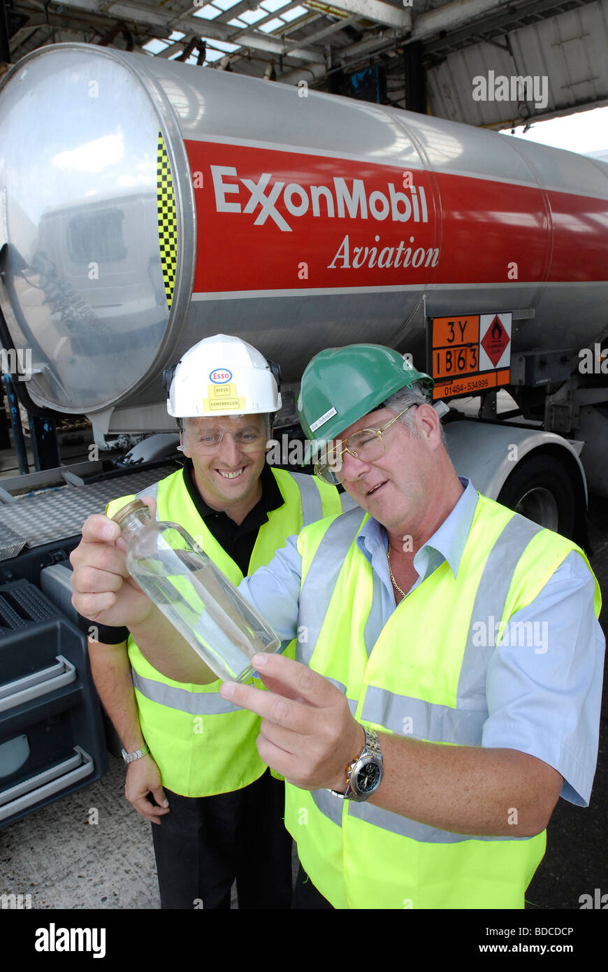 Technicians checking a sample of aviation fuel Stock Photo