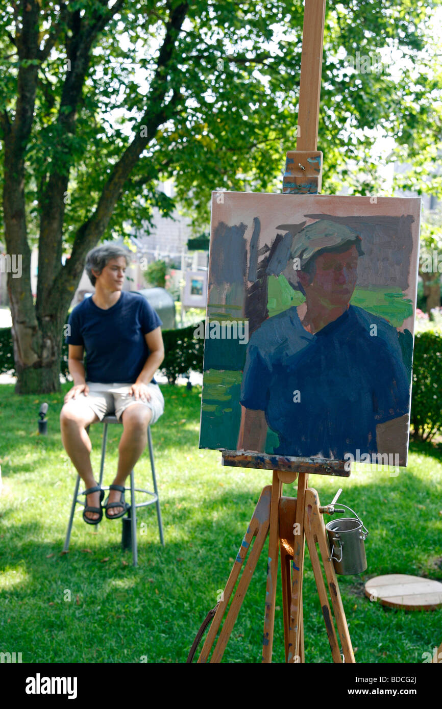 Portrait painting of a model in an art class. Stock Photo