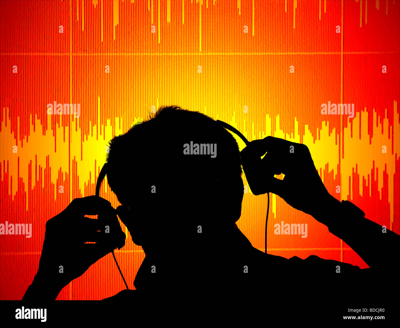 sound engineer studying audio waves on computer screen Stock Photo