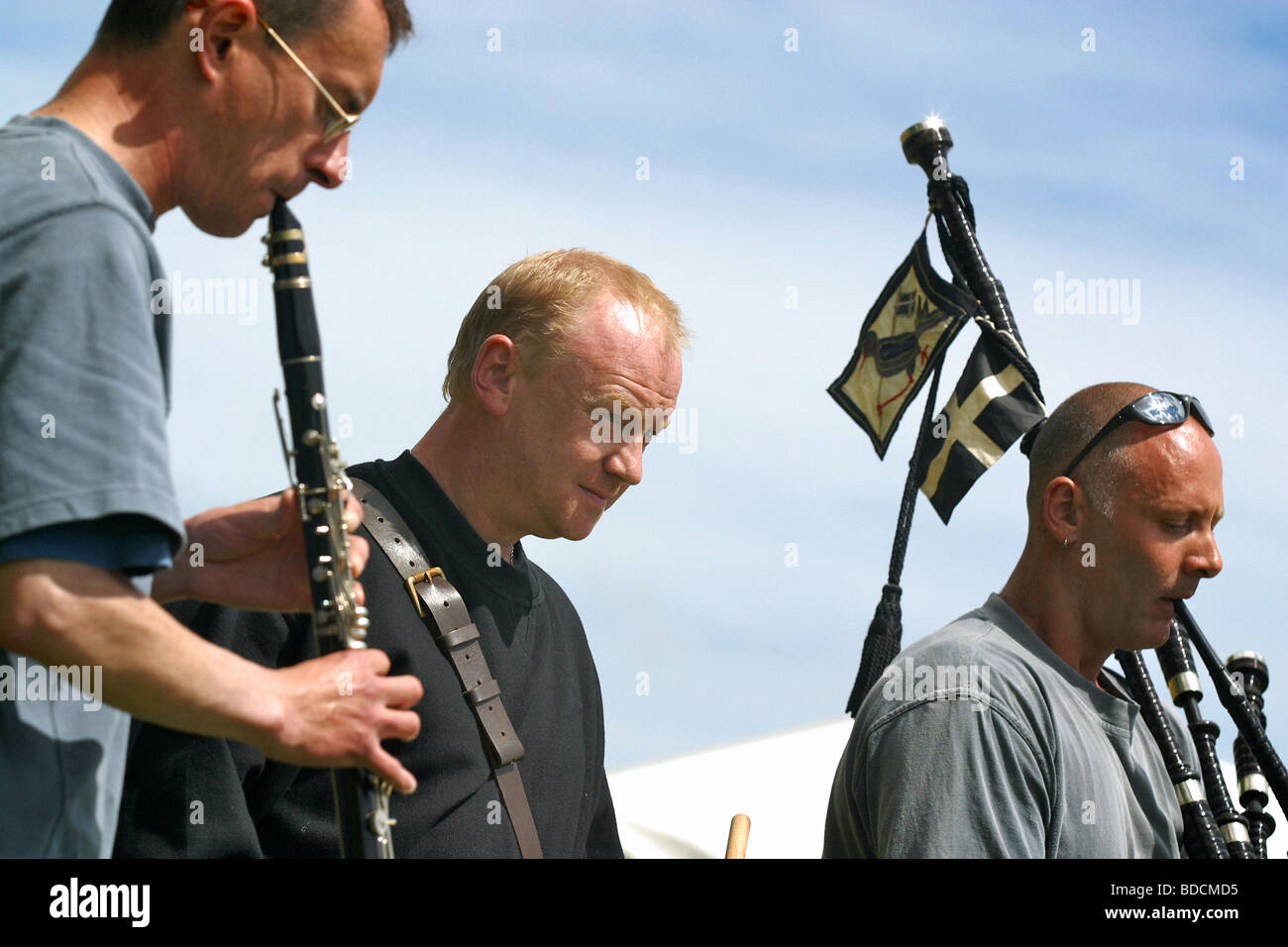 Cornish musicians playing instruments including bagpipes &