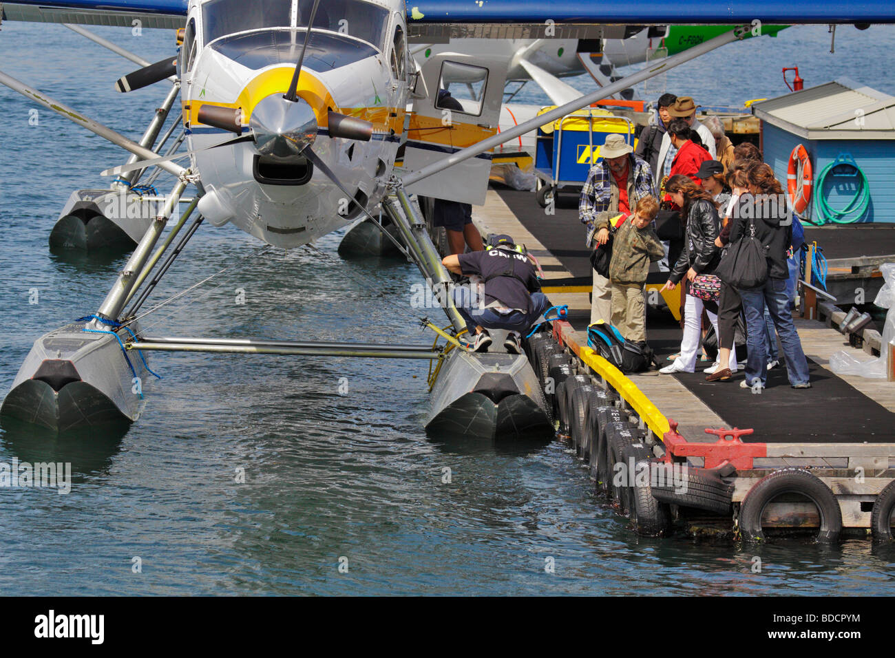 Passengers waiting to board commuter floatplane to Vancouver-Victoria, Vancouver island british columbia canada Stock Photo