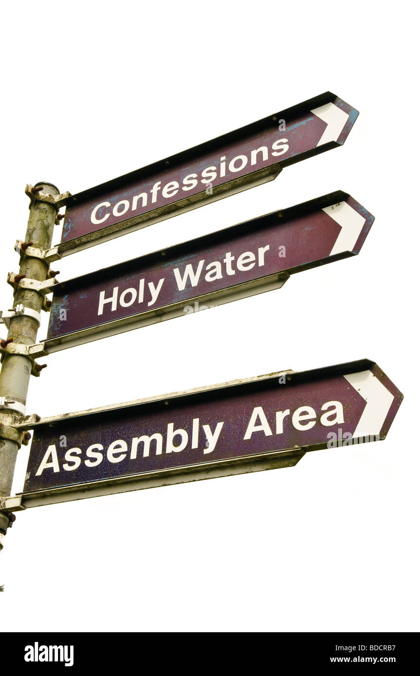 Road signs at Our Lady of Knock Basilica, Ireland, directions to Confessions, Holy Water, and Assemply area Stock Photo