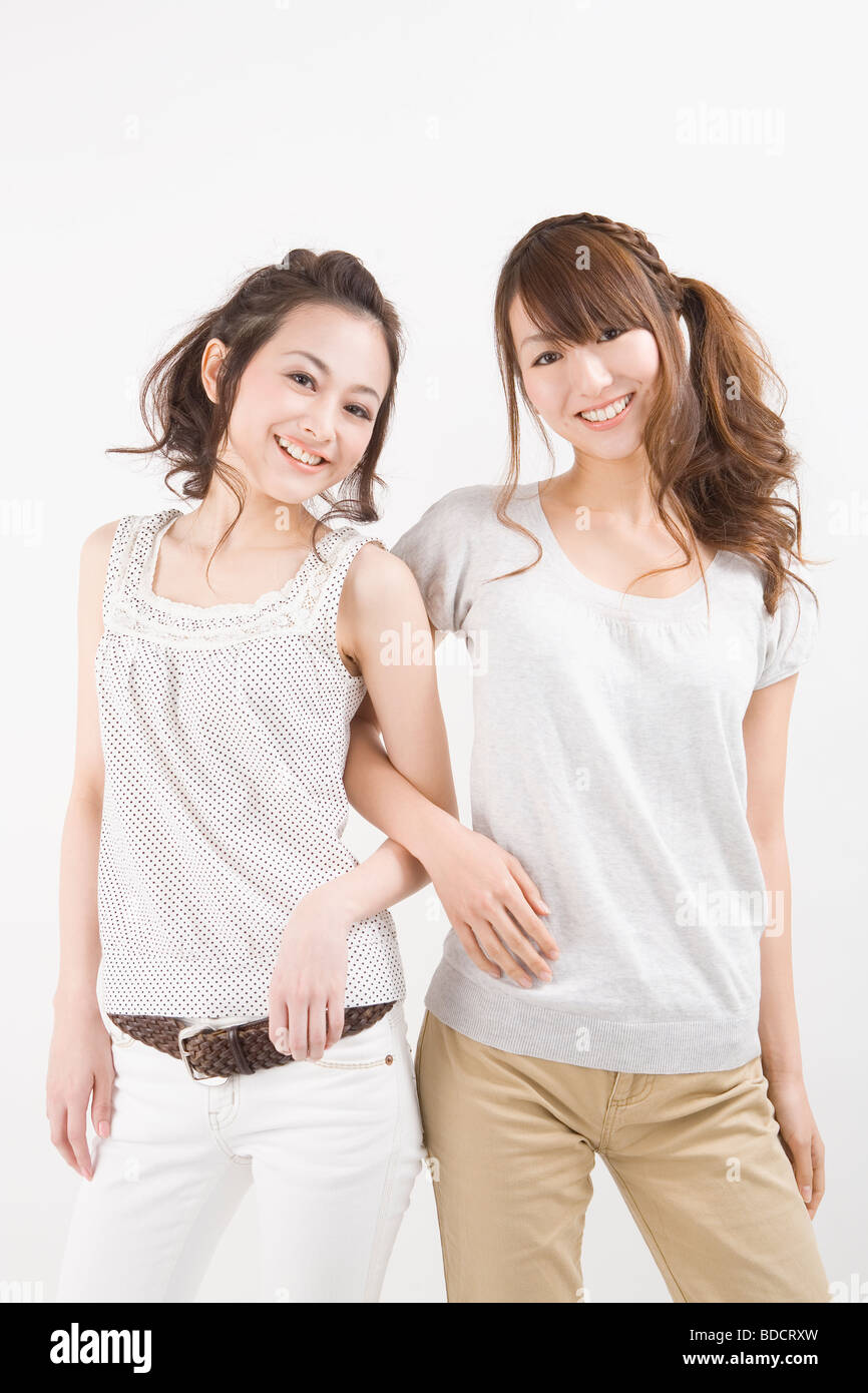 Two young women standing Stock Photo