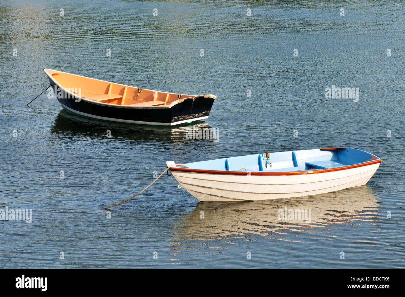 2  wpod rowboats moored in Quissett Harbor, Falmouth, Cape Cod New England  USA in the summer Stock Photo