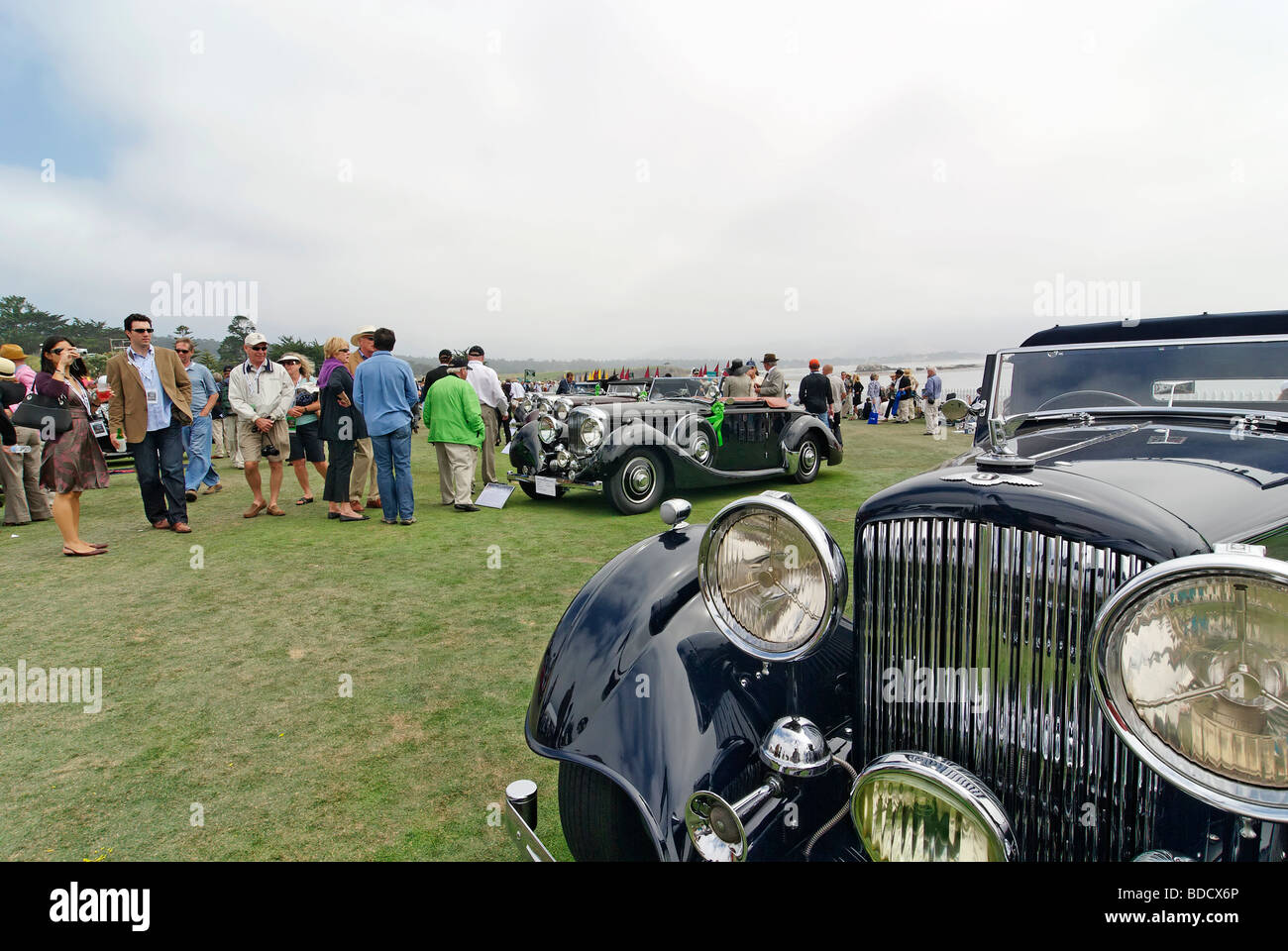 The cars and crowds at the Concours d'Elegance. Stock Photo