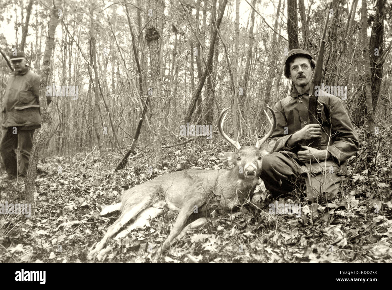 Hunters Posing with Deer Stock Photo