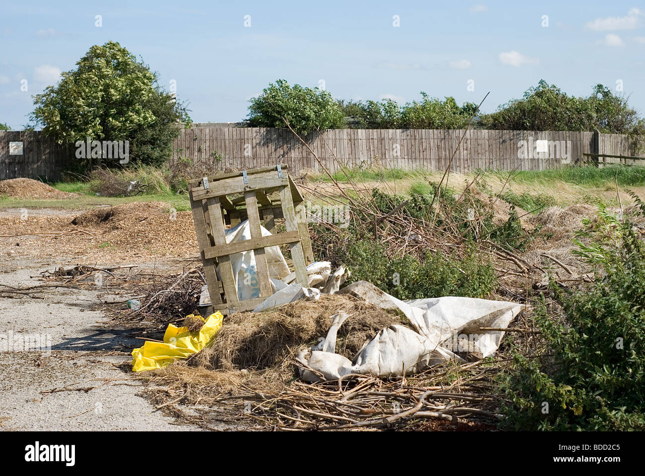 Rubbish dumped on open land fly tip tipping Stock Photo Alamy