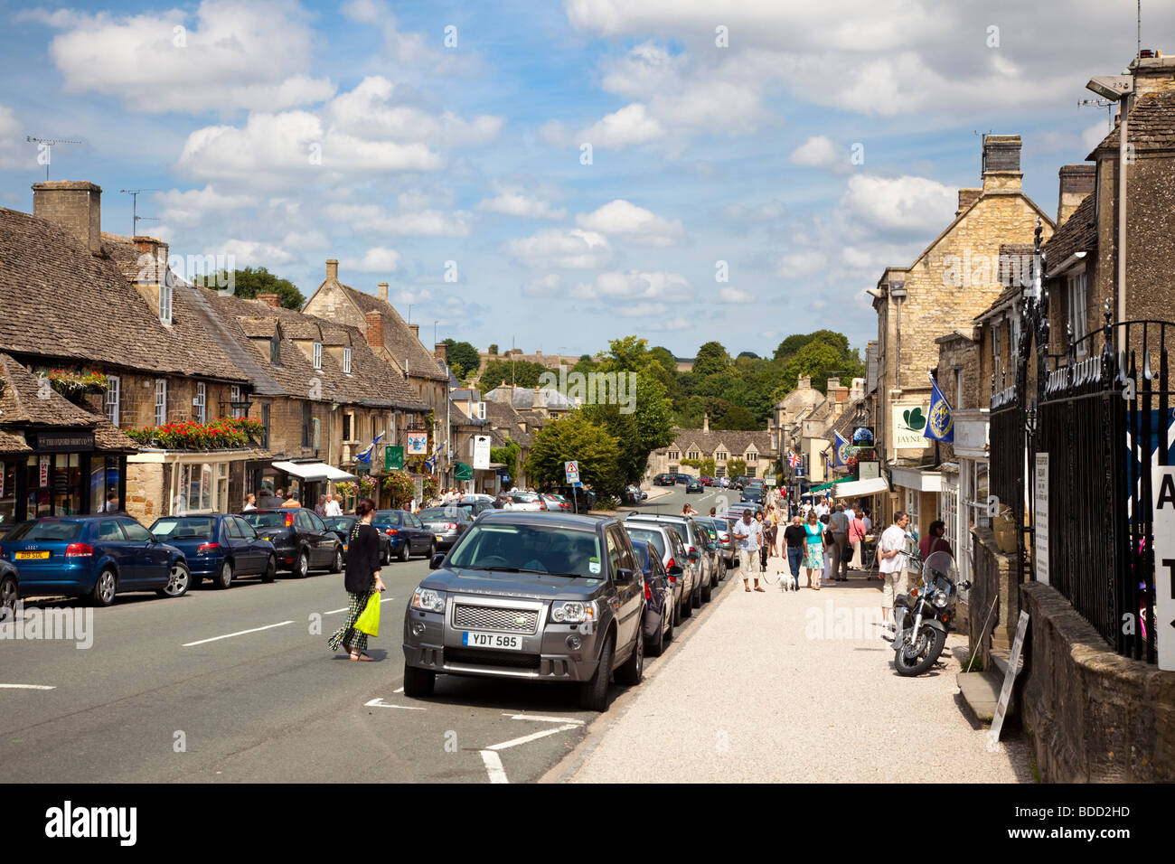 Shopping in the Cotswolds town of Burford, Oxfordshire, England, UK