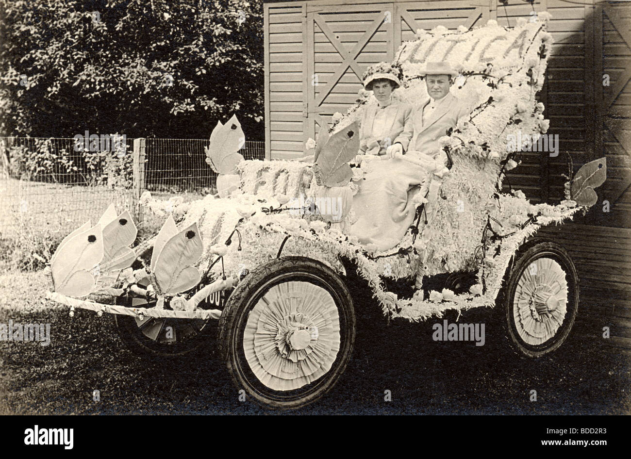Couple in Ford Floral Parade Car Stock Photo