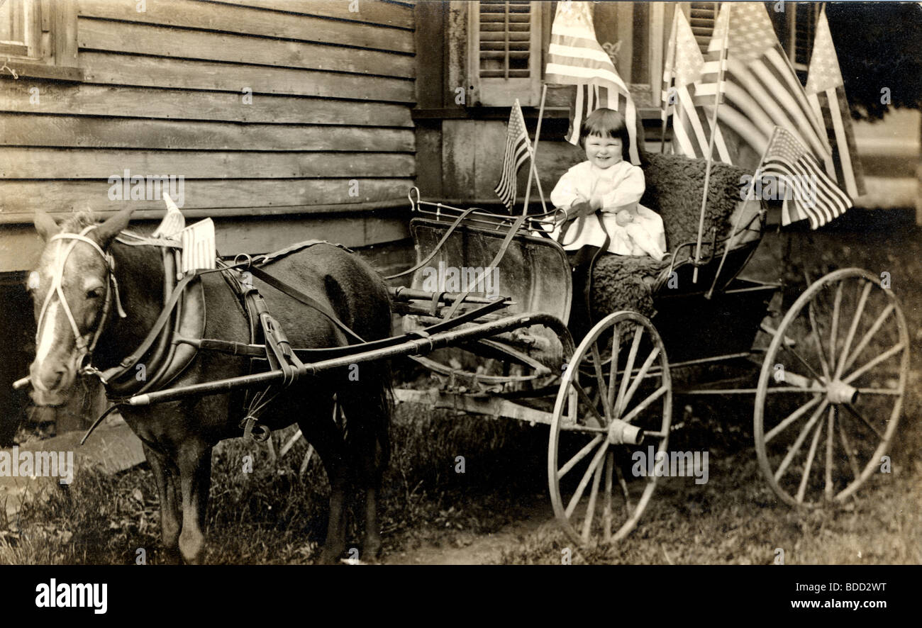 Infant Driving Patriotic Horse Drawn Pony Cart Stock Photo