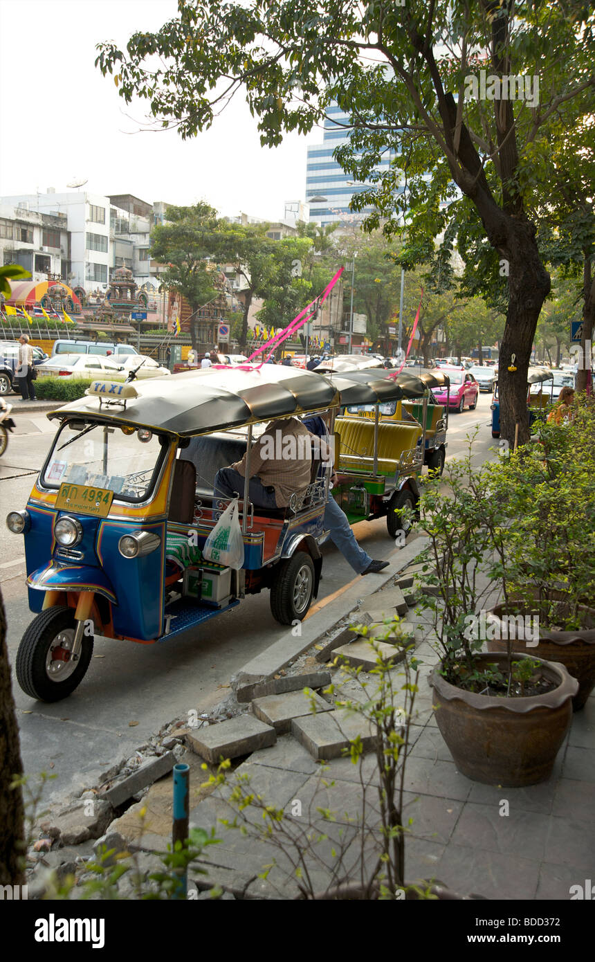 Tuk Tuks parked up on side of the road in Bangkok Thailand Stock Photo