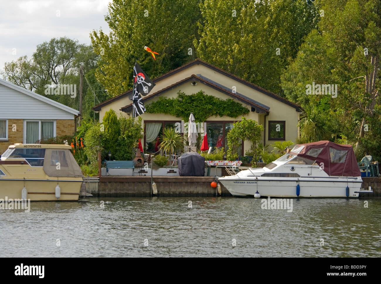 Riverside Property and Moored Boats On Desborough Island The River