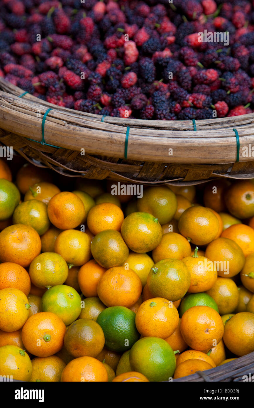 Manderins and berries for sale at a Vietnamese market. Stock Photo