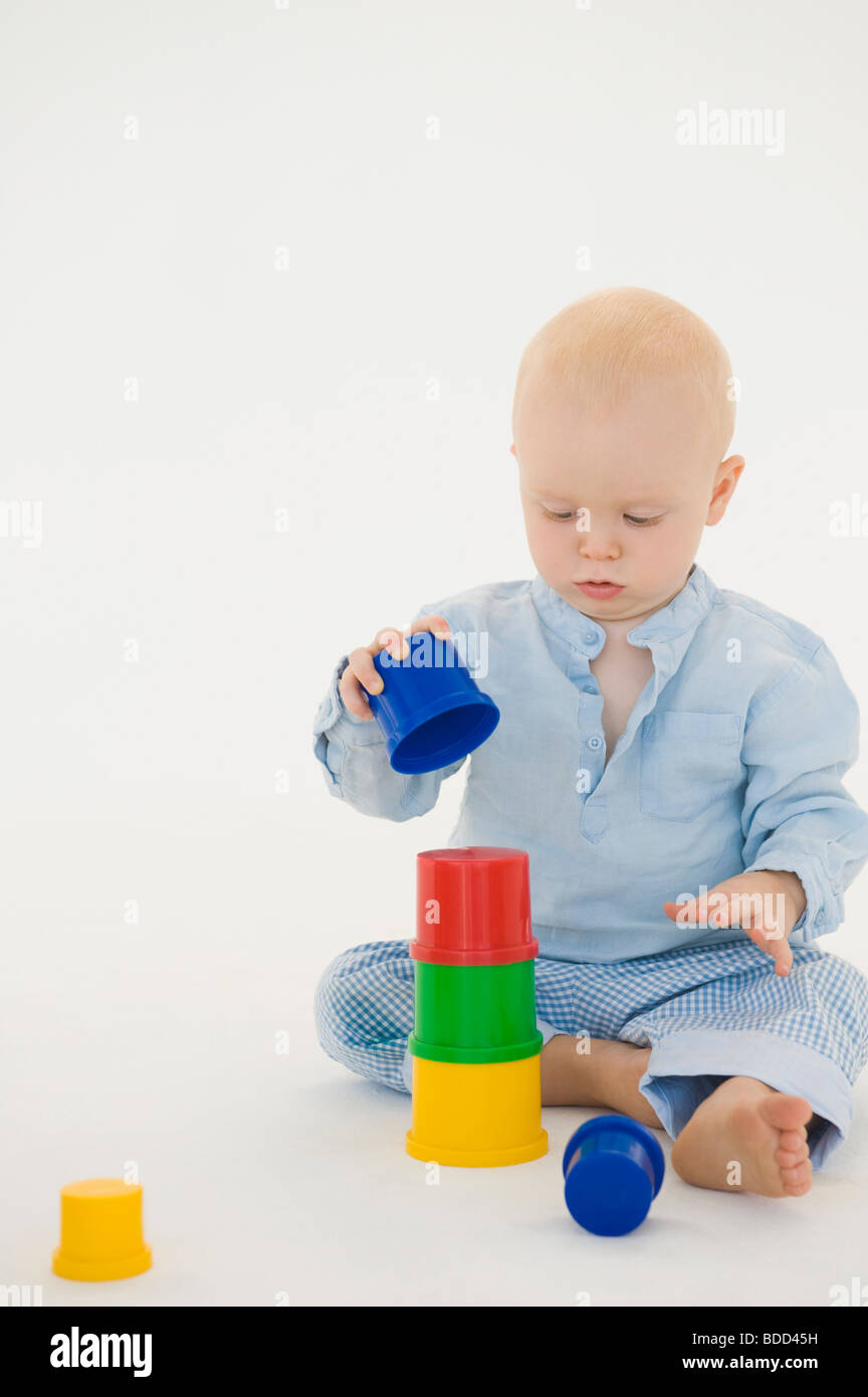 babies stacking blocks