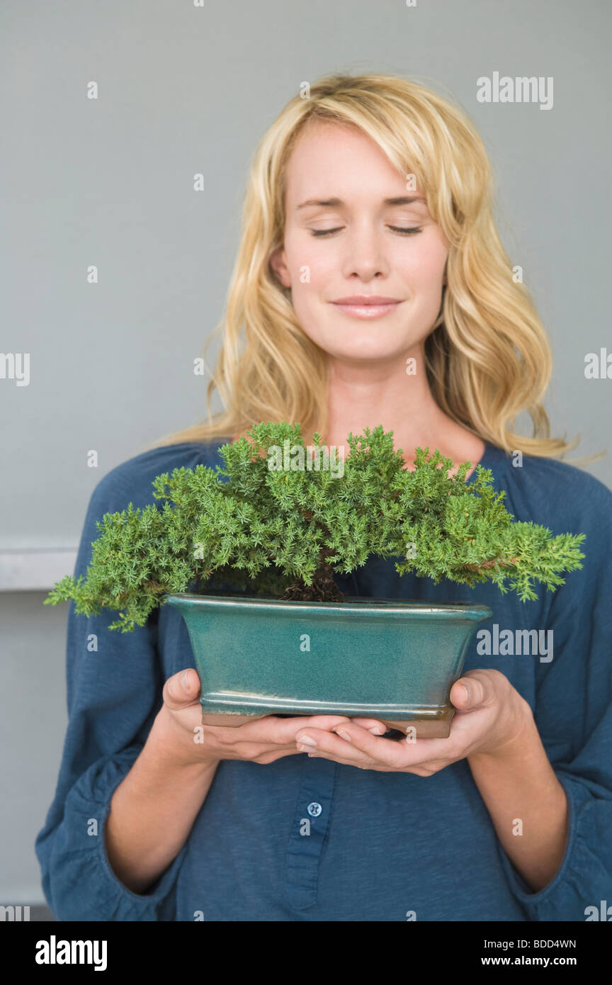 Person holding potted plant hi-res stock photography and images - Alamy