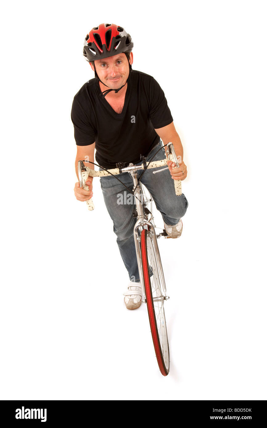 Cyclist riding a racing bicycle on a white background Stock Photo