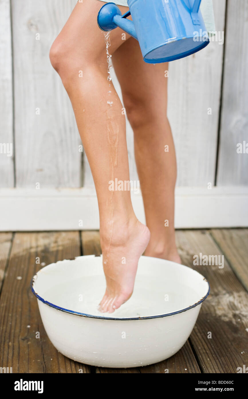 Woman washing legs in the bathroom Stock Photo Alamy