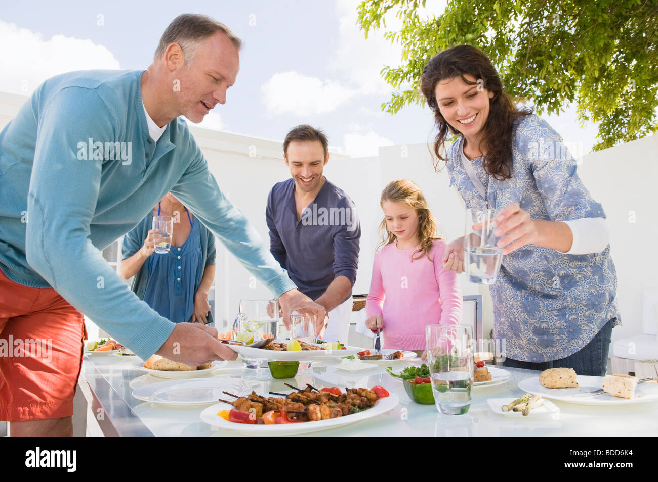 Family having breakfast at the dining table Stock Photo - Alamy