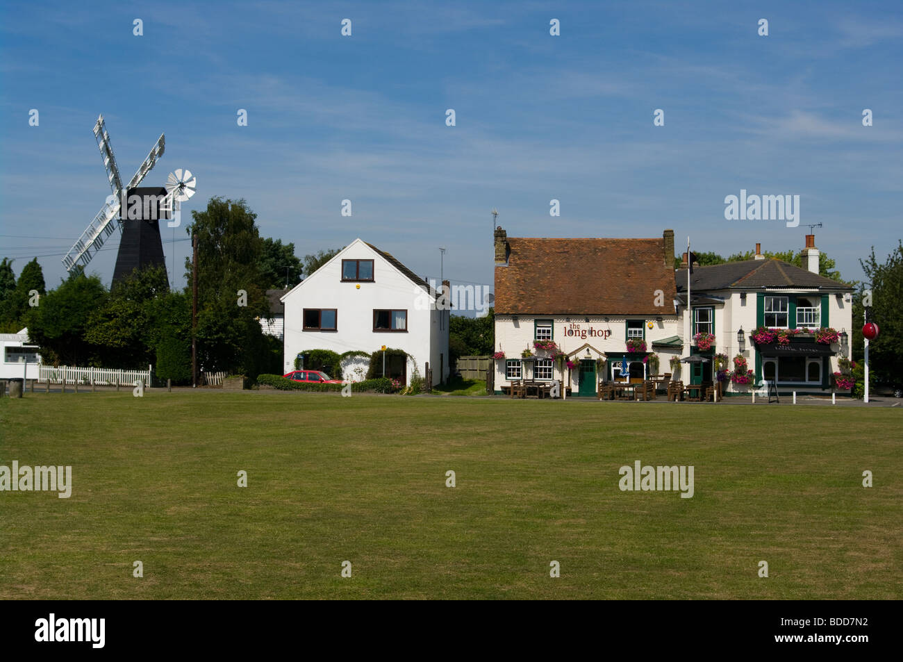 The Long Hop Public House and Windmill On Meopham Village Green Kent Stock Photo