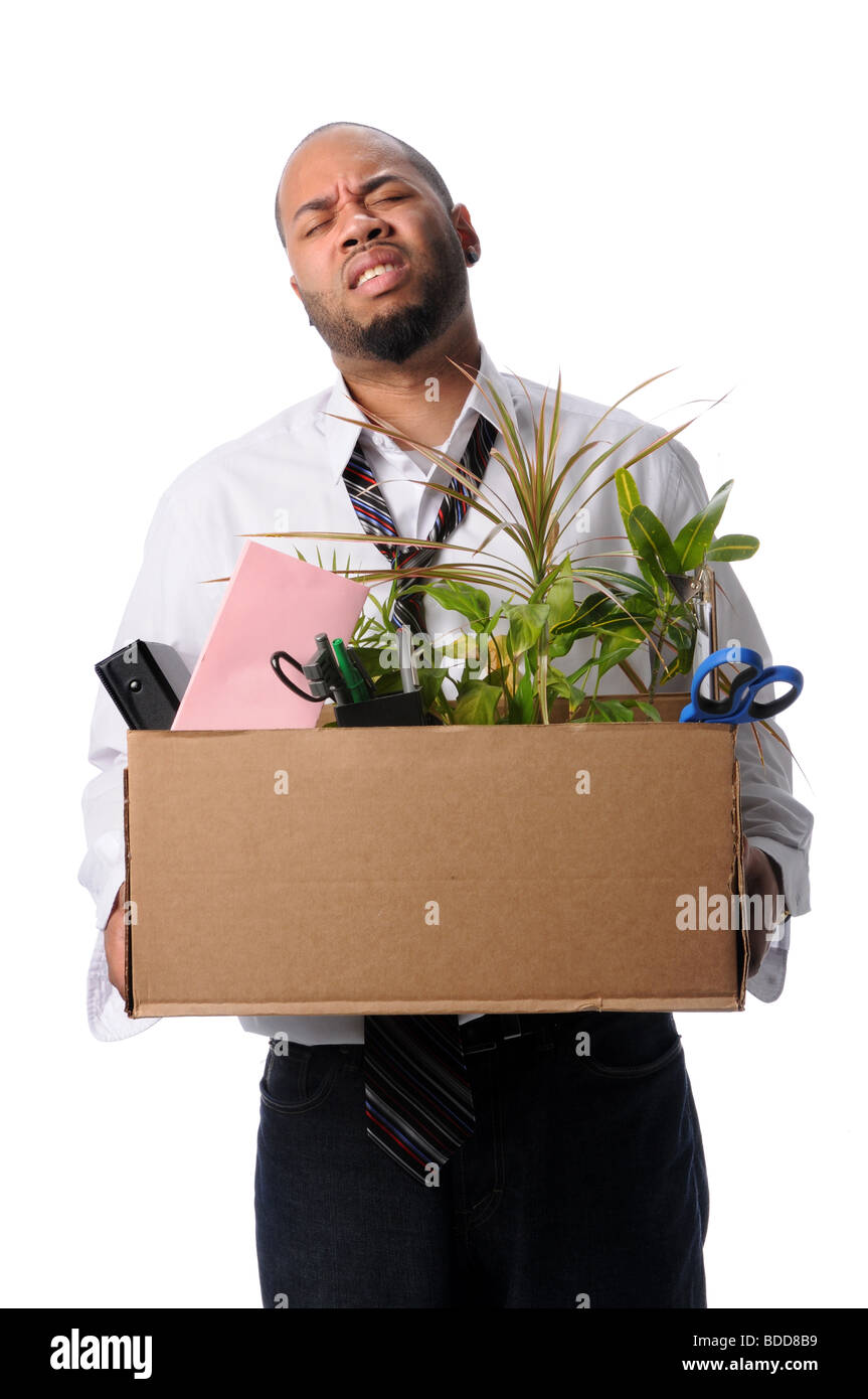 Man Carrying box with belongings after loosing job Stock Photo