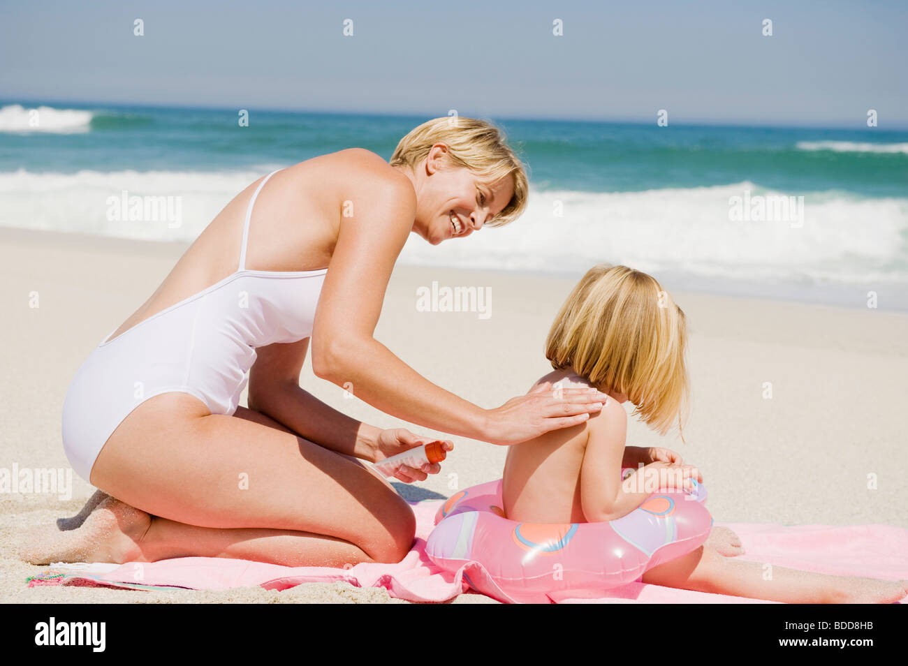 Woman Applying Suntan Lotion On Her Daughter On The Beach Stock Photo Alamy Woman Applying Suntan Lotion On Her Daughter On The Beach Stock Photo Alamy