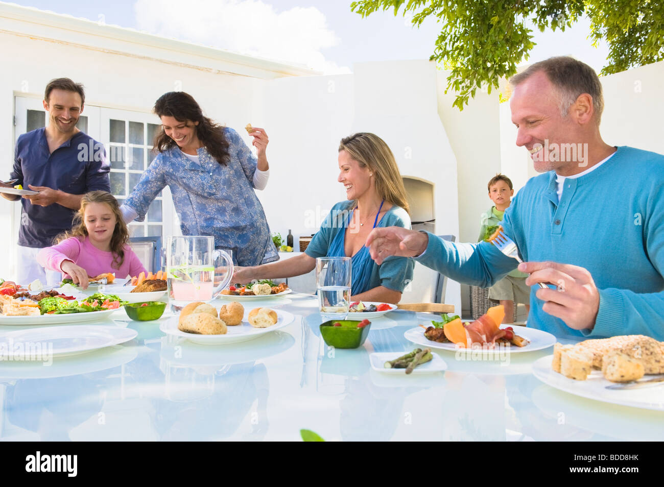 Family having breakfast at the dining table Stock Photo - Alamy