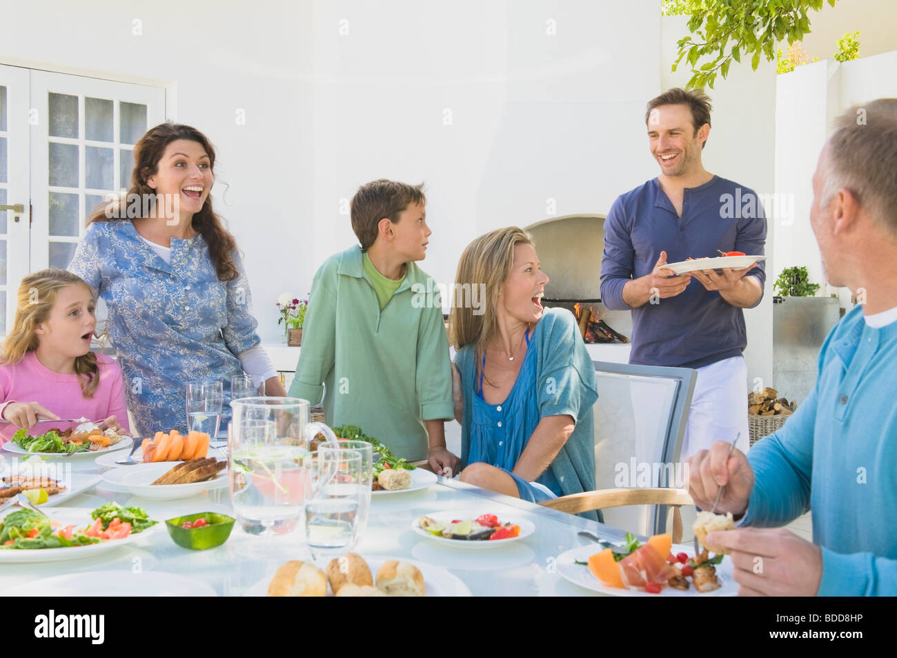 Family having breakfast at the dining table Stock Photo - Alamy