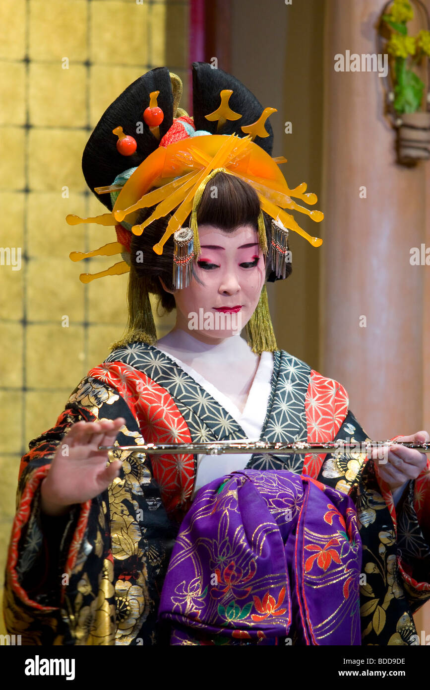 A female performer dressed in traditional geisha outfit performs on stage  at this theme park devoted to Edo period Japan Stock Photo - Alamy