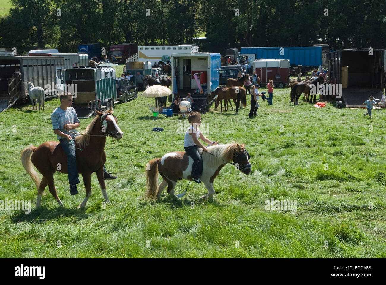 Priddy Horse Fair Mendip Hills, Somerset Uk  Young boys  horse riding  Shetland Pony the horses are for sale 2000s HOMER SYKES Stock Photo