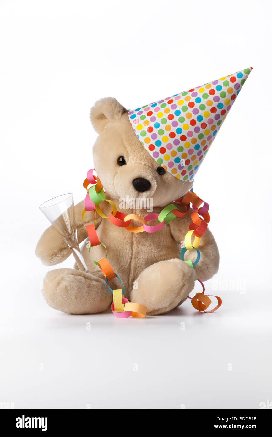 Party bear with hat, glass and decoration Stock Photo