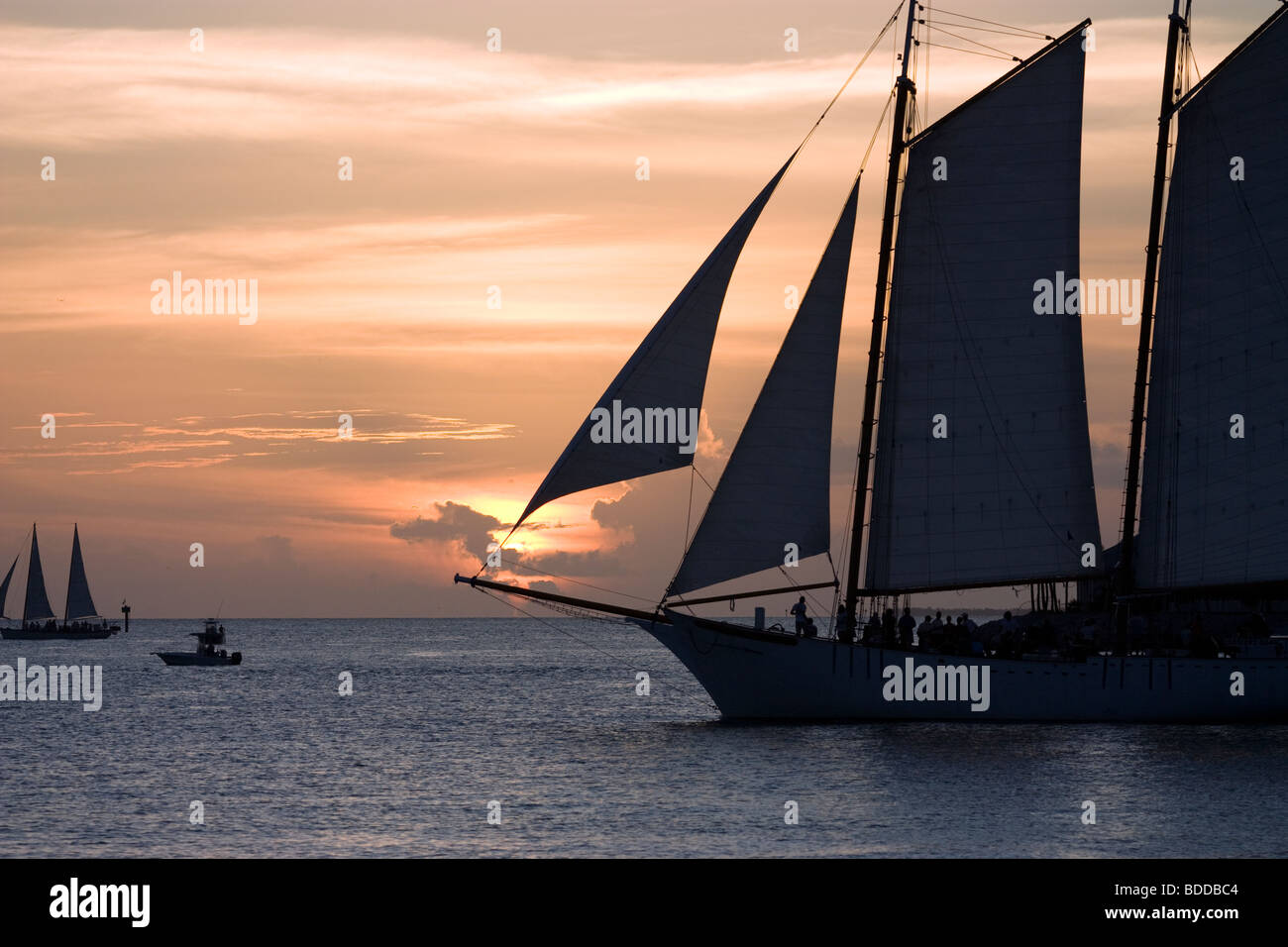 Boats passing through Key West sunset Stock Photo
