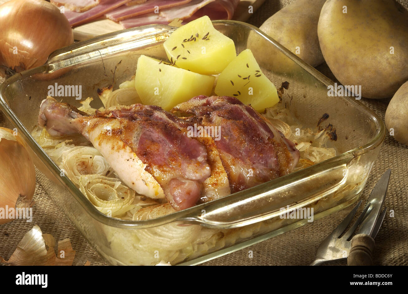 Chicken Baked with Sauerkraut and Bacon Stock Photo Alamy