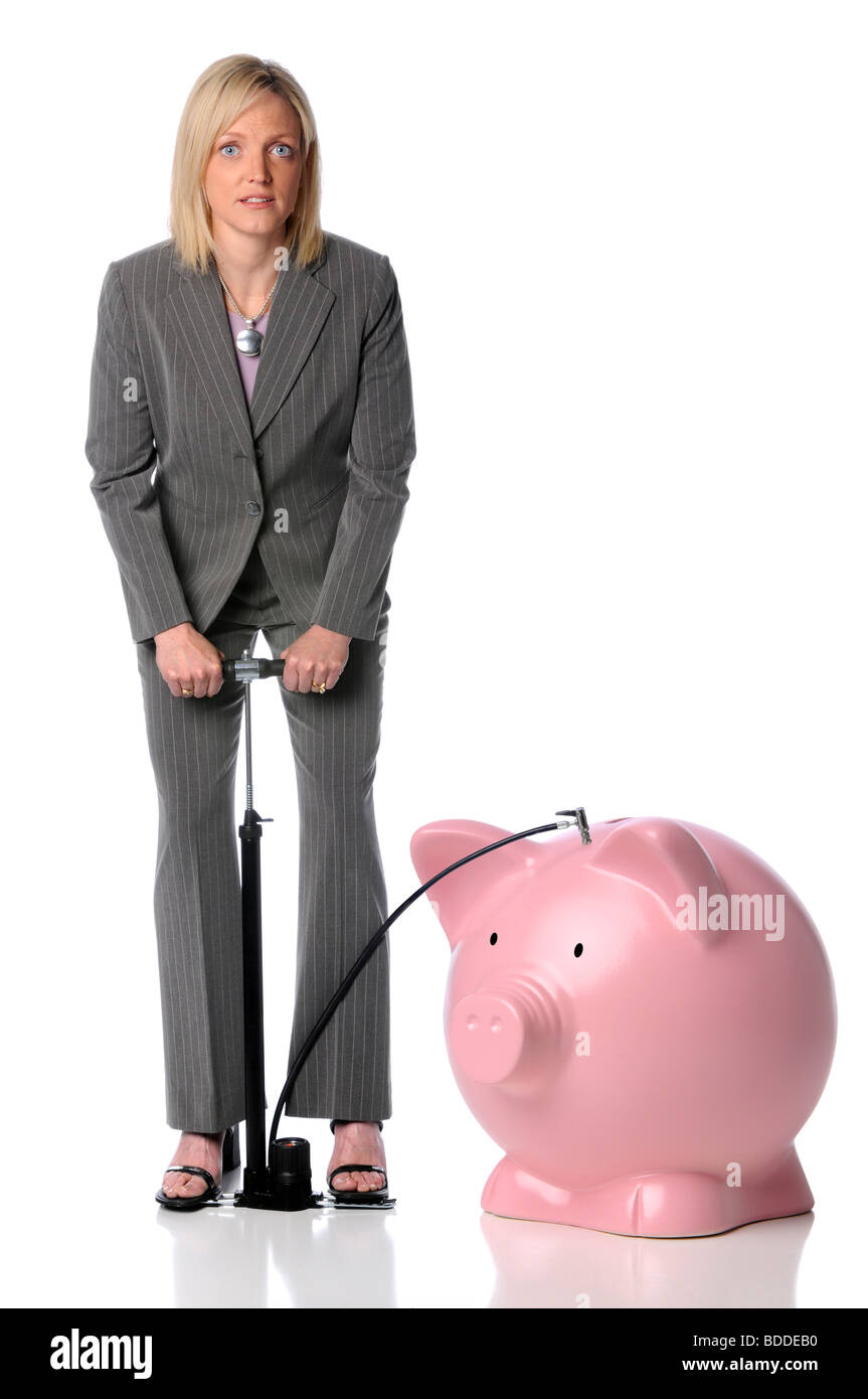 Businesswoman blowing up piggy bank isolated over white Stock Photo