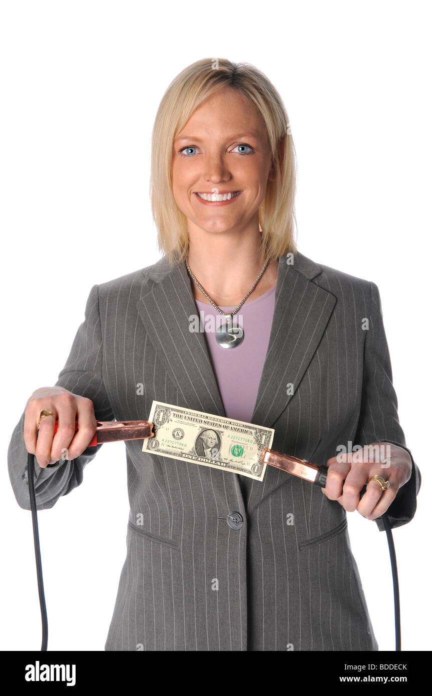 Businesswoman holding dollar bill with jumper cables Stock Photo - Alamy