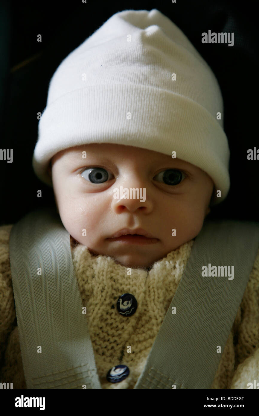 A two month old small baby in a car seat. Model released Stock Photo