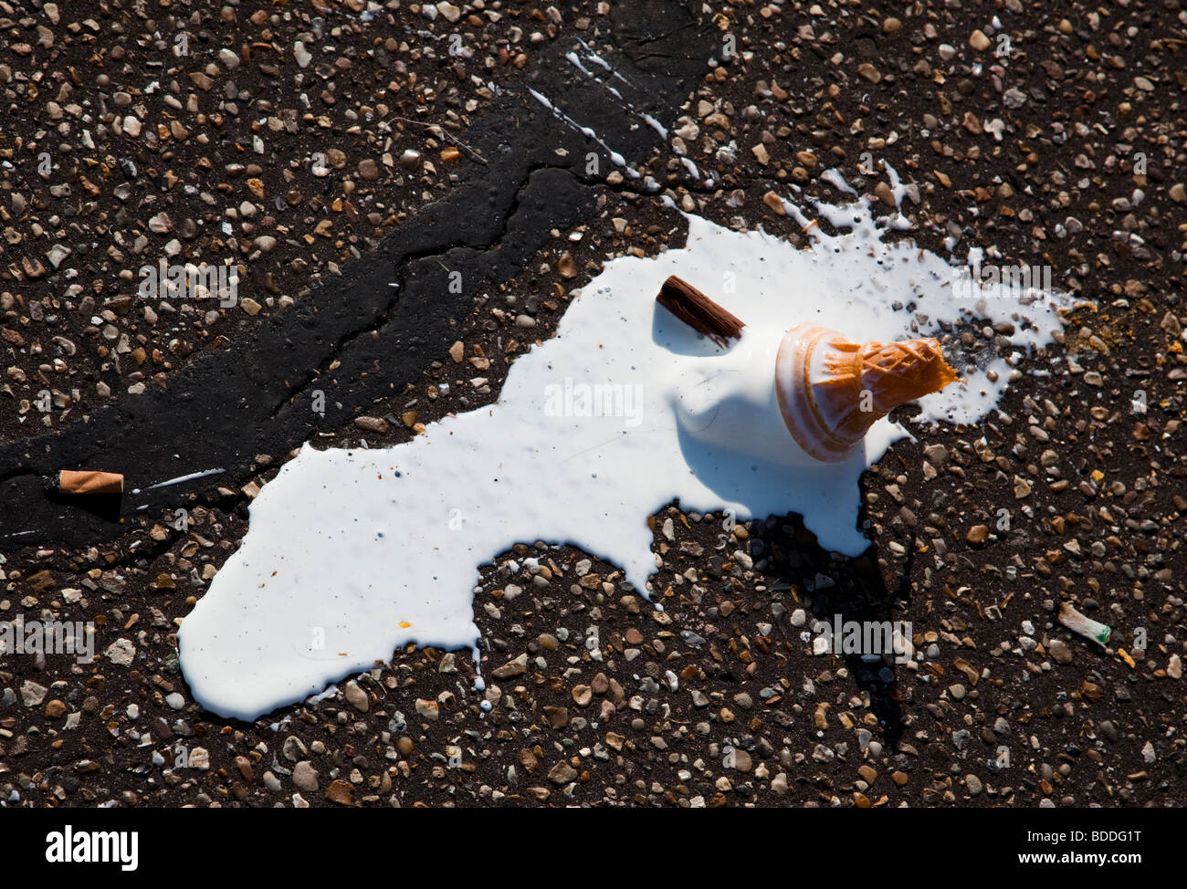 One ice cream cone and two cigarette butts Stock Photo
