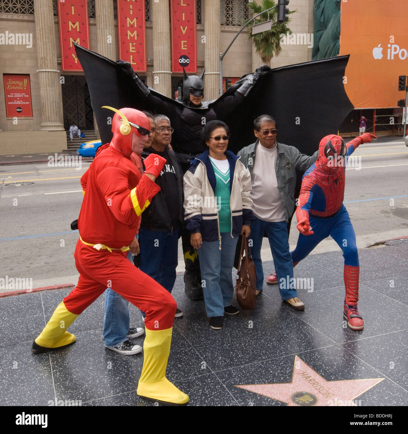 Batman, Spiderman characters and tourists at Walk of Fame at Hollywood Boulevard, Hollywood, California, USA Stock Photo