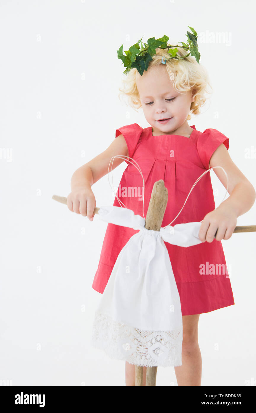 Girl playing with a doll Stock Photo - Alamy
