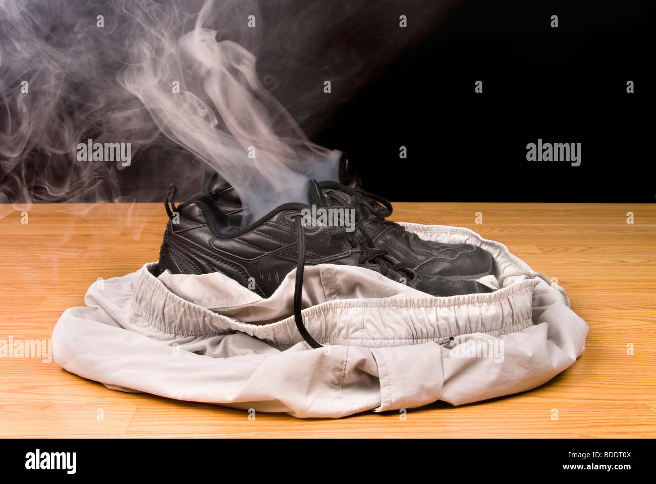 Smoking shoes and shorts insinuate that a person has vanished right out of their clothing. Stock Photo