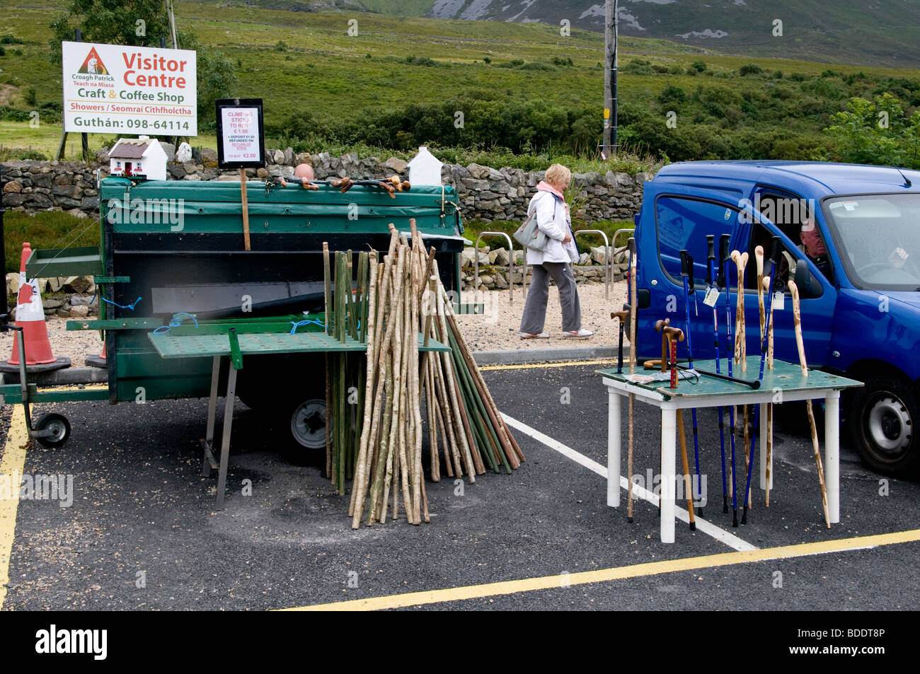 Walking sticks for sale or hire at the base of the pilgrimage mountain