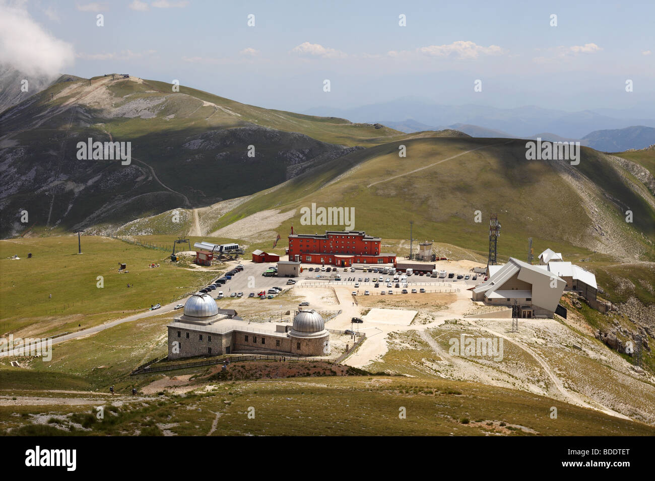Hotel Campo Imperatore (red) and the Observatory in the Gran Sasso D'Italia national park. Stock Photo