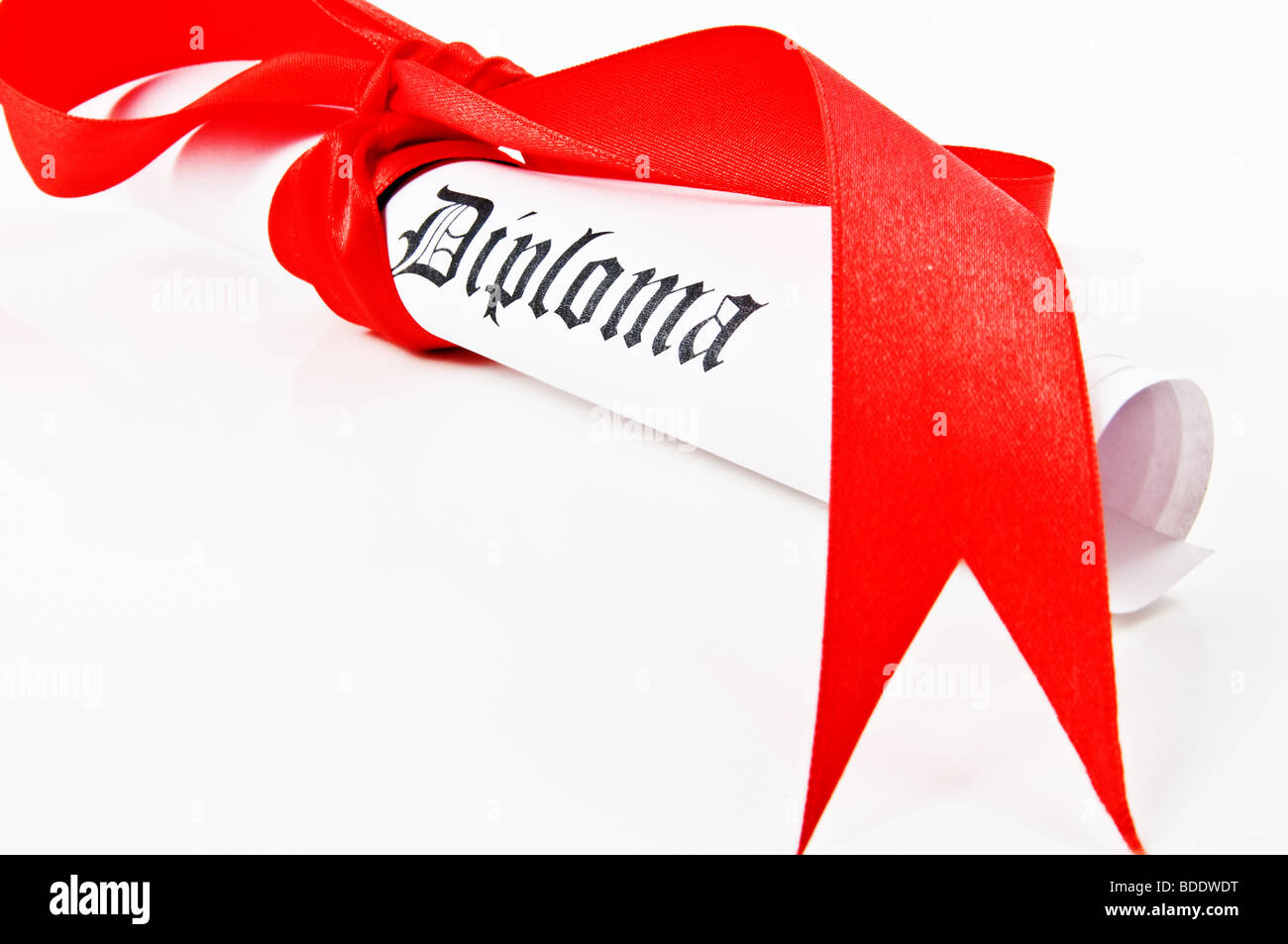 Diploma with red ribbon on white background Stock Photo - Alamy