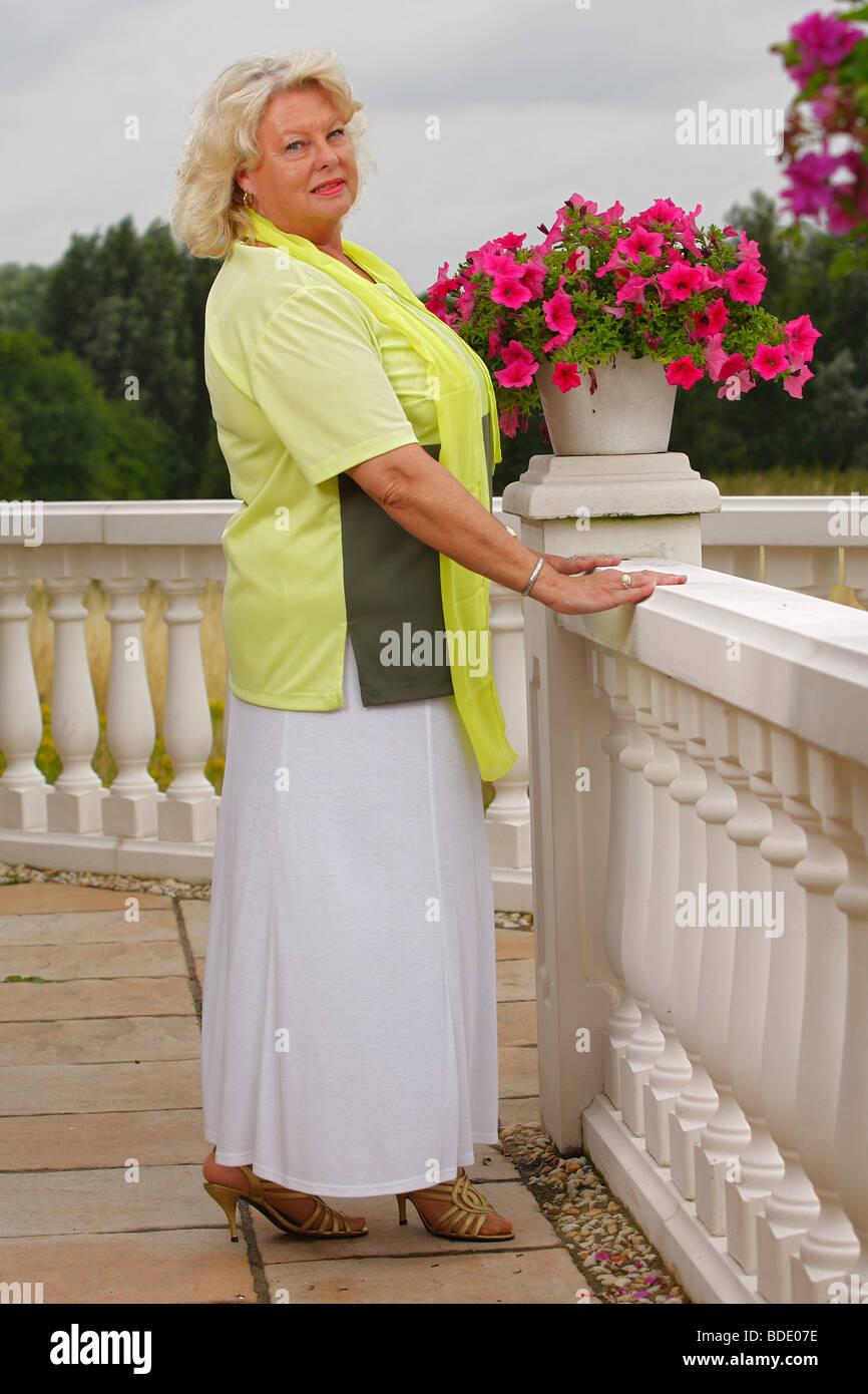 Woman on terrace / balustrade Stock Photo