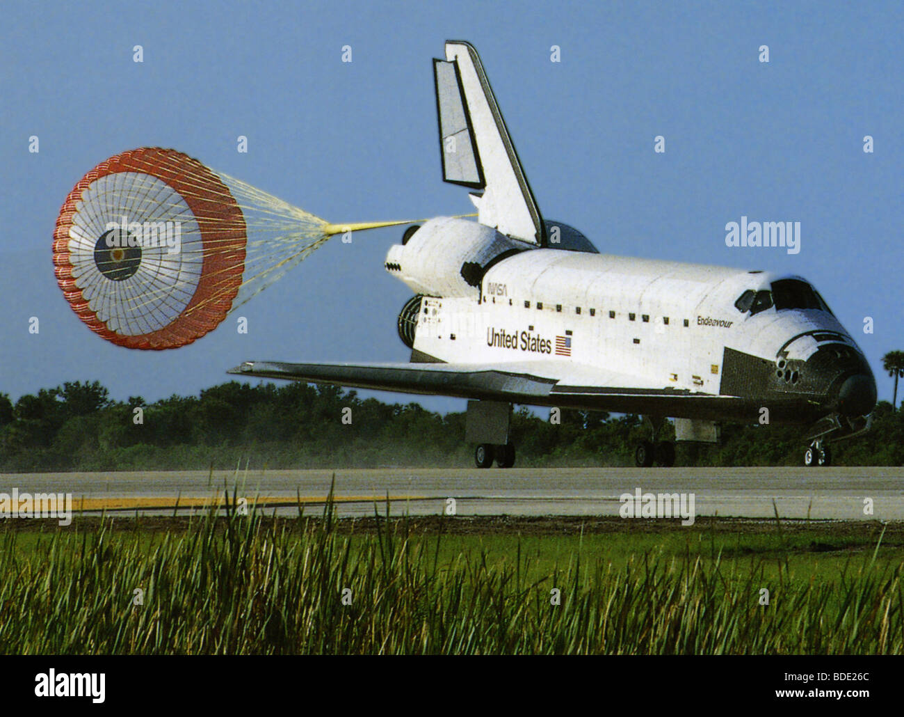 Space shuttle landing with drag chute deployed Stock Photo Alamy